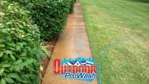 Sidewalk pressure washing and sealing