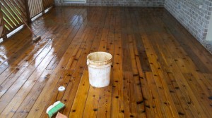 This photo shows deck stain removal in progress