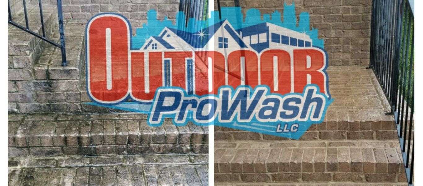 A brick wall with the words " outdoor prowash llc ".