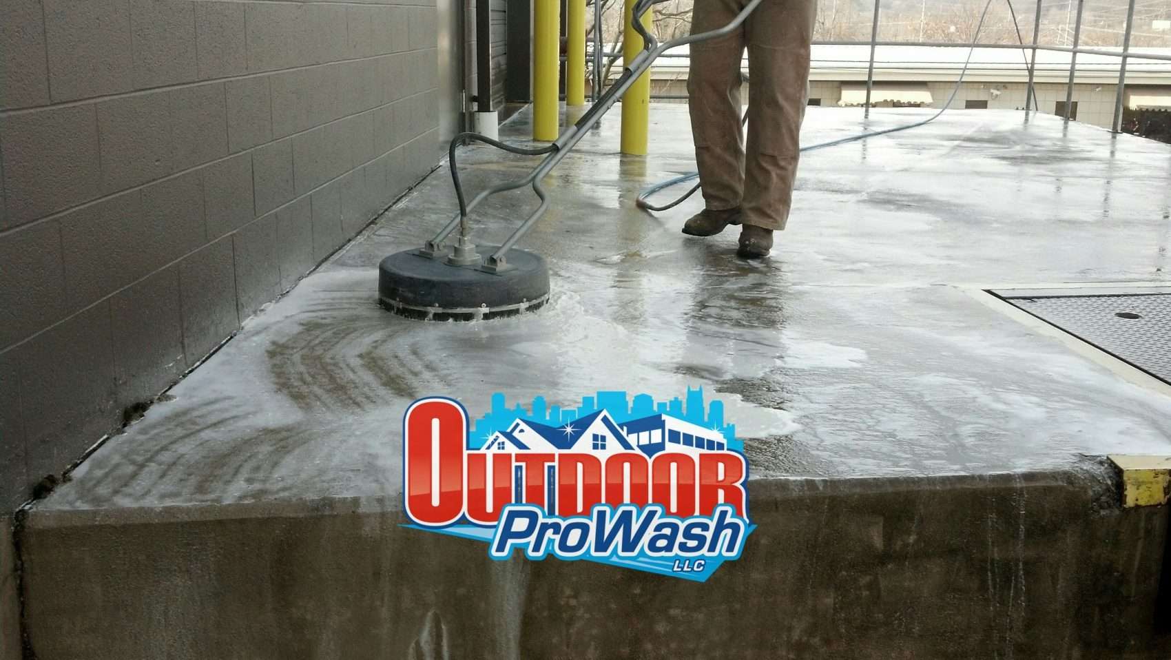 Concrete cleaning with power washer.